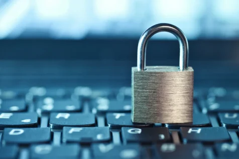 A lock placed on top of a computer keyboard, symbolizing security or data protection.